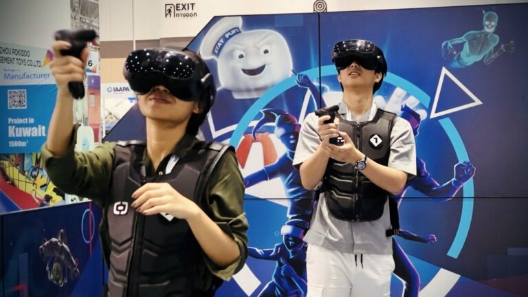Players enjoy the world's first Hologate Wireless setup at IAAPA Asia in Bangkok, Thailand - May 2024