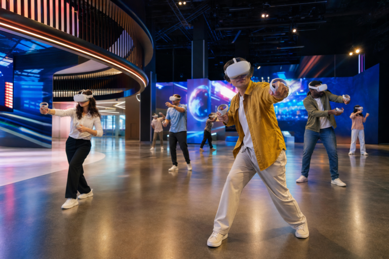 Guests in VR headsets exploring a large modern immersive free-roam entertainment venue