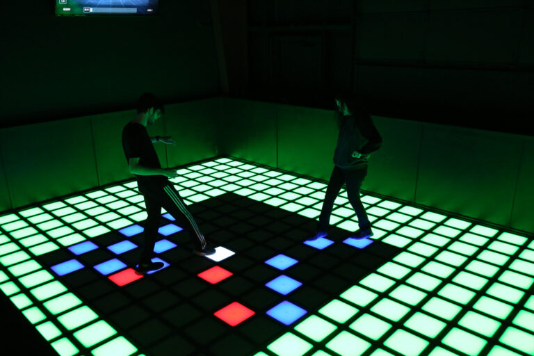Players on a Pixel Floor LED tile floor