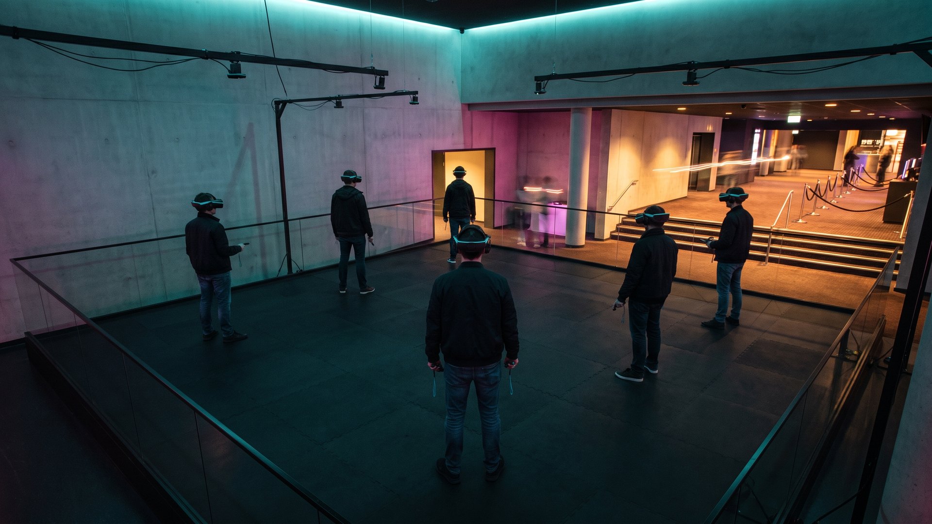 Players in headsets inside a six-player free-roam VR arena in a cinema complex foyer, an Africa VR attraction