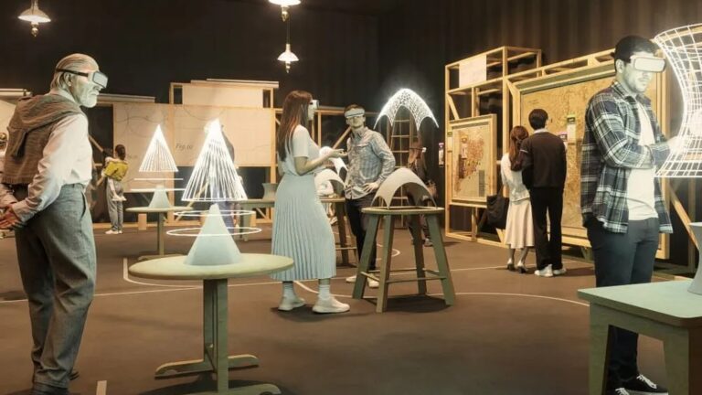 Visitors wearing headsets handle virtual Gaudi structures in the XR Workshop of Gaudi Code, the architecture XR exhibition at Espai Imagina in Barcelona. Image: Espai Imagina
